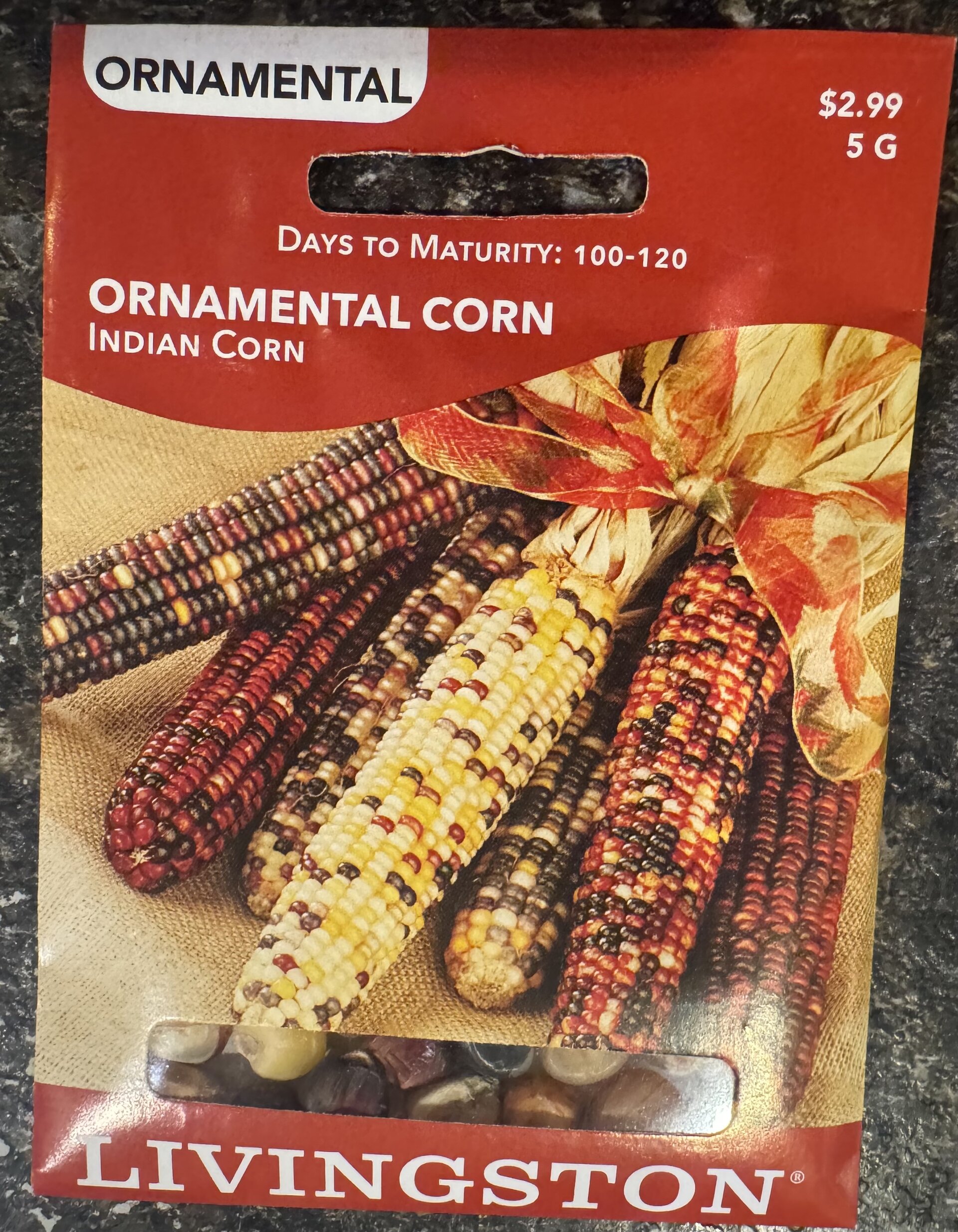 Livingston Ornamental Indian Corn seed packet showing colorful multi-hued cobs with red, yellow, cream, and purple kernels